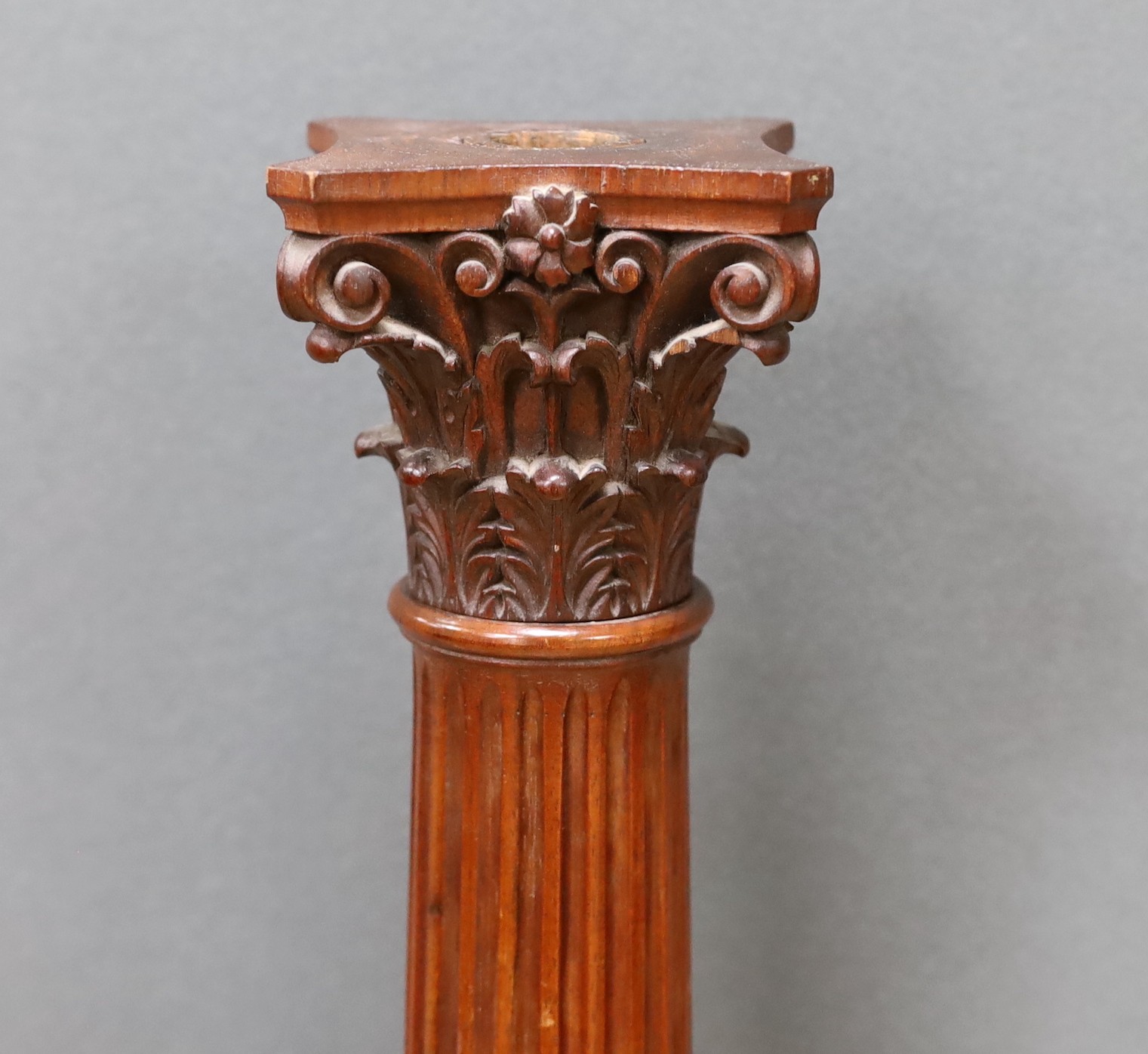An early 20th century carved walnut Corinthian column, 80cm high